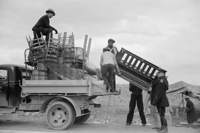 Framed Print : State highway officials moving protesting sharecroppers, Jan. 1936. Roadside belongings are loaded into trucks as a policeman watches, ending the protest Framed Print : State highway officials moving protesting sharecroppers, Jan. 1936. Roadside belongings are loaded into trucks as a policeman watches, ending the protest