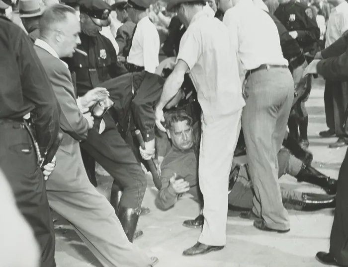 Framed Print : State trooper on the ground after he was hit by a rioter's rock during the Paul Robeson concert. Peekskill, N.Y. Sept. 4, 1949