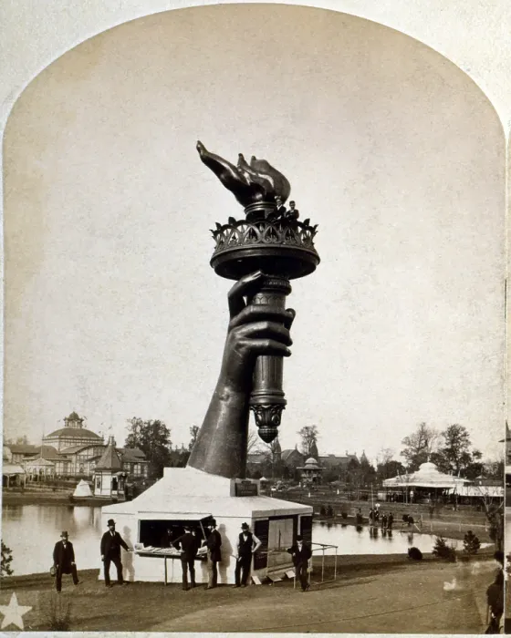 Framed Print : Statue of Liberty. The torch and part of the arm of the Statue of Liberty, on display at the 1876 Centennial Exhibition in Philadelphia. Stereograph ca. 1876