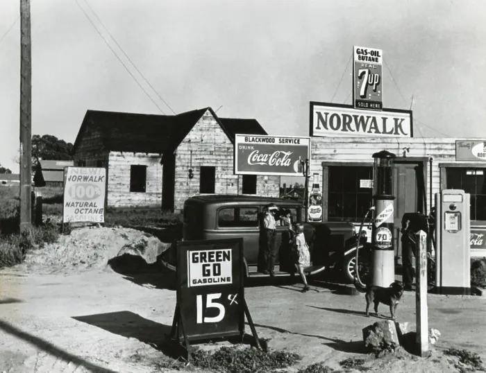 Framed Print : Store near a San Joaquin Valley shack town community of migrant workers, April 9, 1940. It sells gasoline at 15 cents a gallon and post signs for Coca Cola, 7 Up, and Pepsi soda