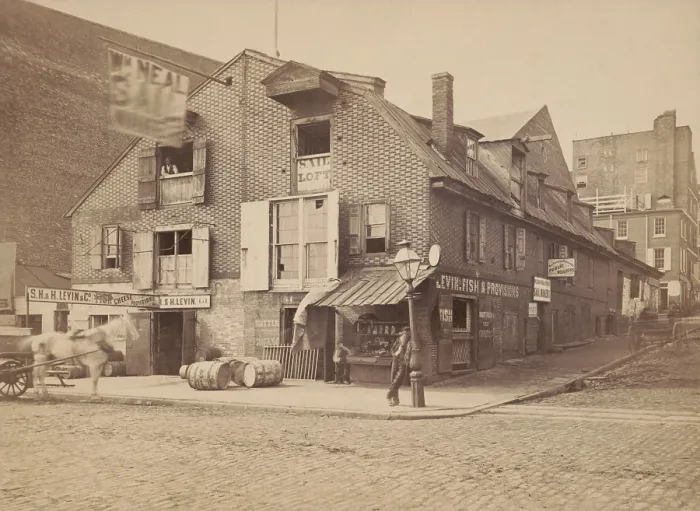 Framed Print : Stores on Philadelphia's Race Street Wharf, c. 1880. Brick building's business tenants include a fish and cheese store, a sail maker, and public weigher