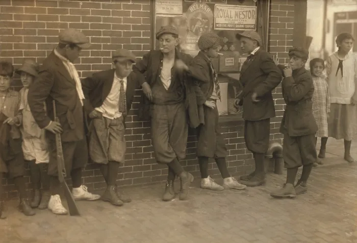 Framed Print : Street gang of cigarette smoking youths loiter on the corner of Margaret & Water Streets in Springfield, Massachusetts. 1916 photo by Lewis Hine Framed Print : Street gang of cigarette smoking youths loiter on the corner of Margaret & Water Streets in Springfield, Massachusetts. 1916 photo by Lewis Hine