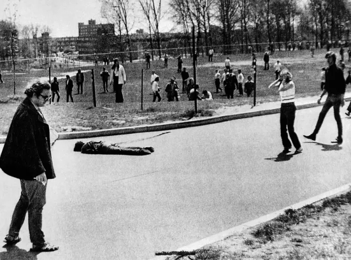 Framed Print : A student lies dead at Kent State University. He was one of 4 students killed when National Guardsmen fired 67 rounds in 13 seconds into a student demonstration. May 4, 1970