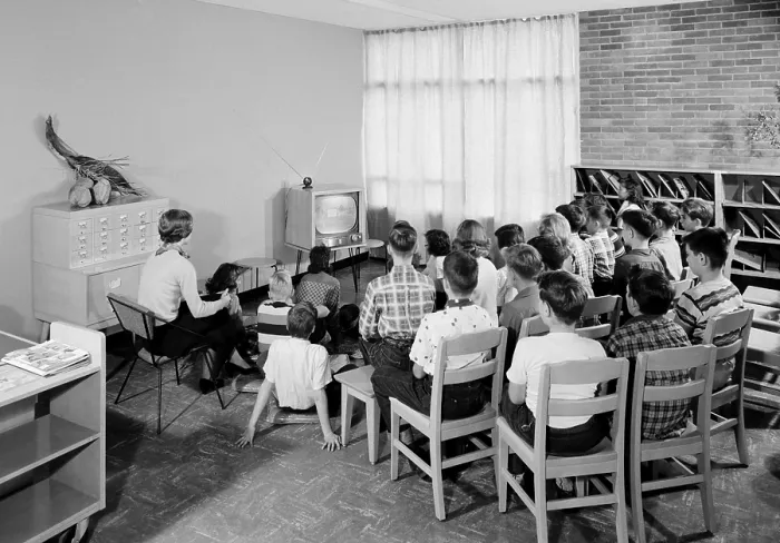 Framed Print : Students and their teacher watch educational television in a school library in Schenectady, New York, 1954