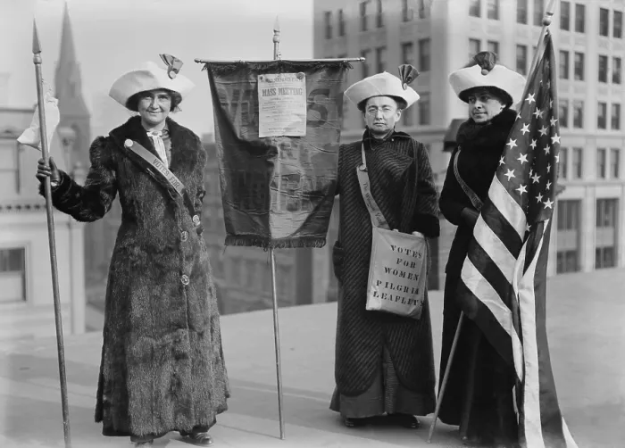 Framed Print : Three suffragettes demonstrate in New York City to promote Suffrage Hike of 1912 from Manhattan to Albany and distribute their VOTES FOR WOMEN PILGRIM leaflets