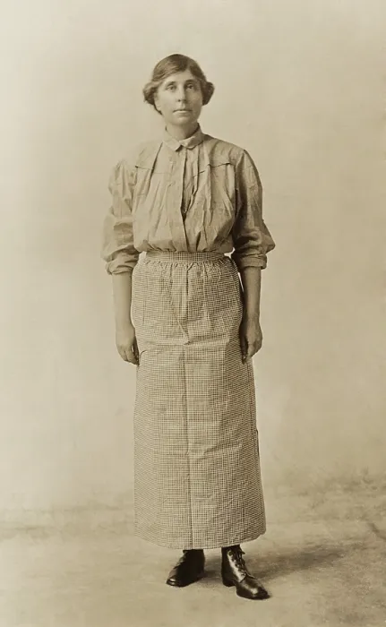 Framed Print : Suffragist Abby Scott Baker, models a prison dress. She was imprisoned for picketing in Washington, D.C