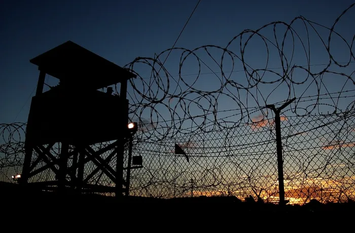 Framed Print : The sun sets on Camp X-Ray's first day as an active compound on Jan. 11 2002