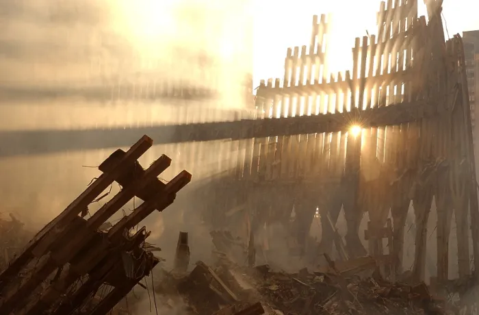 Framed Print : Sun streams through the dust over the wreckage of the World Trade Center. New York City, Sept. 15, 2001. (BSLOC_2015_2_83)