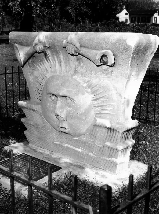 Framed Print : Surviving sunstone at the reconstructed Mormon Temple at Nauvoo, Illinois. It depicts sun face emerging between clouds beneath a pair of hand-held trumpets