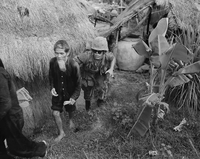 Framed Print : Suspected Viet Cong detainee. US Marine captures an elderly Viet Cong suspect during a search and clear operation 15 miles west of Da Nang Air Base. Aug. 3, 1965
