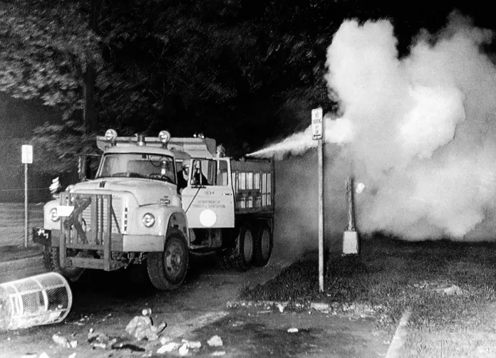 Framed Print : Tear gas is sprayed in into crowds assembled in Grant Park during the 1968 Democratic National Convention