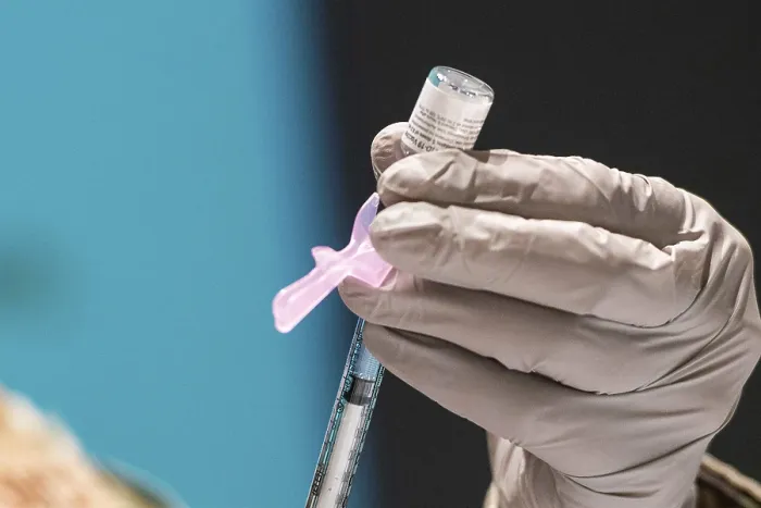 Framed Print : A technician loads a syringe with the Pfizer-BioNTech COVID-19 vaccine at Wright-Patterson Air Force Base, Ohio, Jan. 5, 2021 (BSLOC_2021_1_25)