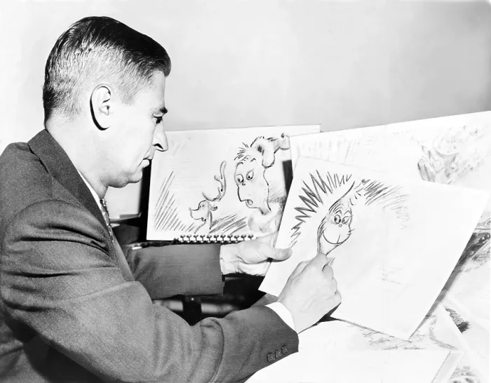 Framed Print : Ted Geisel (Dr. Seuss) (1904-1991) at work on a drawing of the Grinch, a character in his book, 'How the Grinch Stole Christmas.' 1957