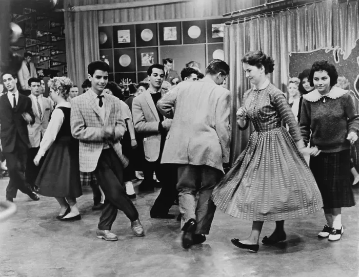 Framed Print : Teens dancing on Dick Clark's American Bandstand in 1961. Some are dancing the Twist, recently popularized by Chubby Checker's 1960 single, The Twist Framed Print : Teens dancing on Dick Clark's American Bandstand in 1961. Some are dancing the Twist, recently popularized by Chubby Checker's 1960 single, The Twist