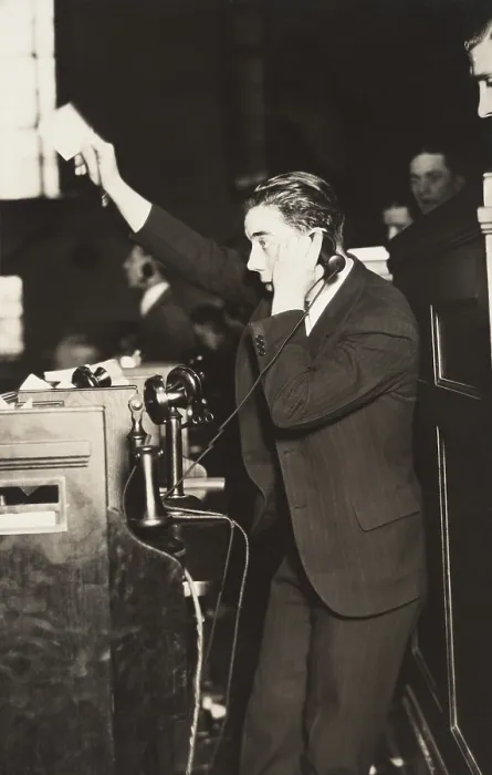 Framed Print : Telephone clerk waving a note and calling a trader on the floor of the New York Curb Exchange. Jan. 24, 1929 (BSLOC_2016_8_31)