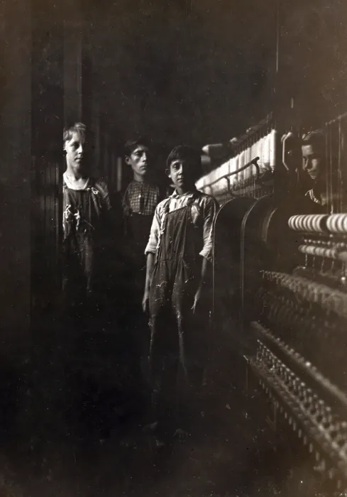 Framed Print : A textile mill. Some of the small boys working in the Amoskeag Mfg. Co. Manchester, N.H, photograph by Lewis Wickes Hine, May 25, 1909