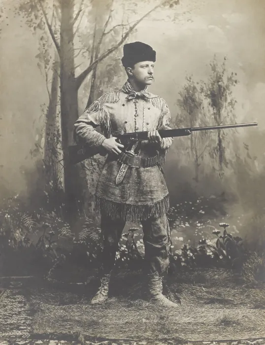 Framed Print : Theodore Roosevelt, in buckskin hunting suit, holding rifle in 1885 studio portrait. He designed the suit himself, which was crafted for him by a Dakotan woman, Mrs Framed Print : Theodore Roosevelt, in buckskin hunting suit, holding rifle in 1885 studio portrait. He designed the suit himself, which was crafted for him by a Dakotan woman, Mrs