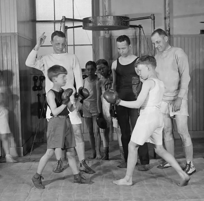 Framed Print : Theodore Roosevelt Jr. (1887-1944), coaching boys in a boxing match. His son, Cornelius, is the boy fighting on the left. March 22, 1924