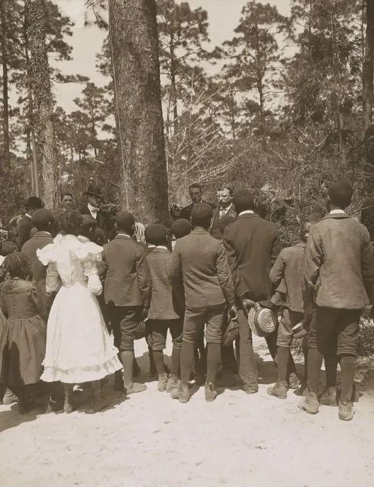 Framed Print : Theodore Roosevelt listening to African American child singing, April 10, 1902. They were child laborers on the Pinehurst Tea Farm, Summerville, South Carolina (BSLOC_2017_6_55)