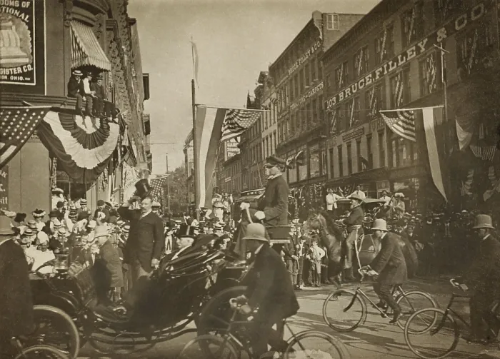Framed Print : Theodore Roosevelt standing in a carriage, tipping his hat, escorted by bicycle police in 1902. Unidentified location (BSLOC_2017_4_54) Framed Print : Theodore Roosevelt standing in a carriage, tipping his hat, escorted by bicycle police in 1902. Unidentified location (BSLOC_2017_4_54)