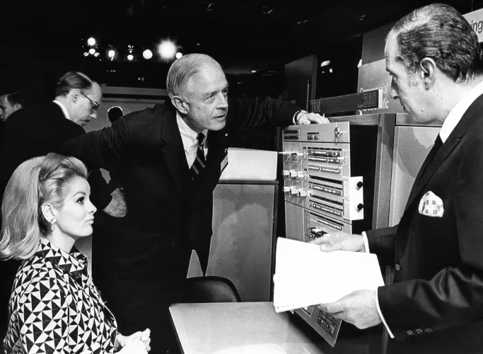 Framed Print : Thomas J. Watson, Jr. talks with IBM stockholders before their yearly meeting in the New York Coliseum. The IBM system / 360 40 model was on display. April 24, 1967 Framed Print : Thomas J. Watson, Jr. talks with IBM stockholders before their yearly meeting in the New York Coliseum. The IBM system / 360 40 model was on display. April 24, 1967