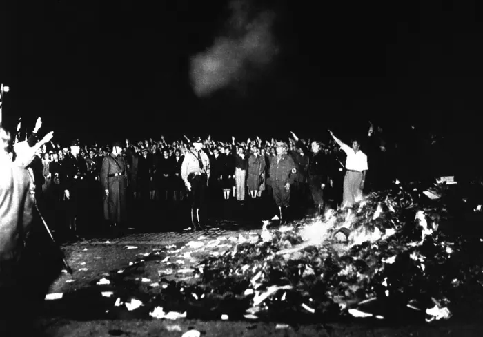 Framed Print : Thousands of books smolder in a huge Nazi huge bonfire, 1933