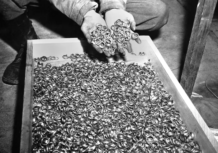 Framed Print : Thousands of gold wedding rings removed from victims of the Nazi German concentration camps. U.S