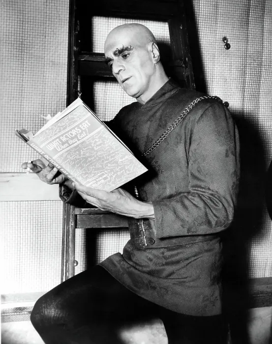 Framed Print : TOWER OF LONDON, BORIS KARLOFF enjoys a cigarette and a read during a production break, 1939 Framed Print : TOWER OF LONDON, BORIS KARLOFF enjoys a cigarette and a read during a production break, 1939