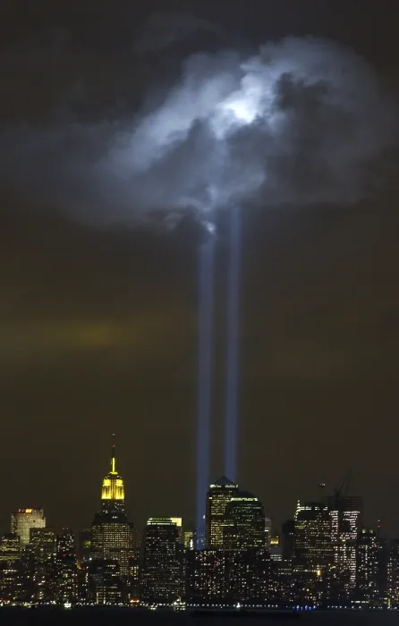 Framed Print : Tribute in Light Memorial illuminates a passing cloud above lower Manhattan. Sept. 9, 2004