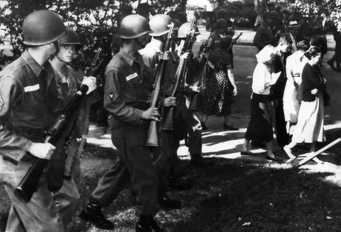 Framed Print : Troopers order parents and students who joined a protest march at Central High School in Little Rock, Arkansas to move away from school grounds