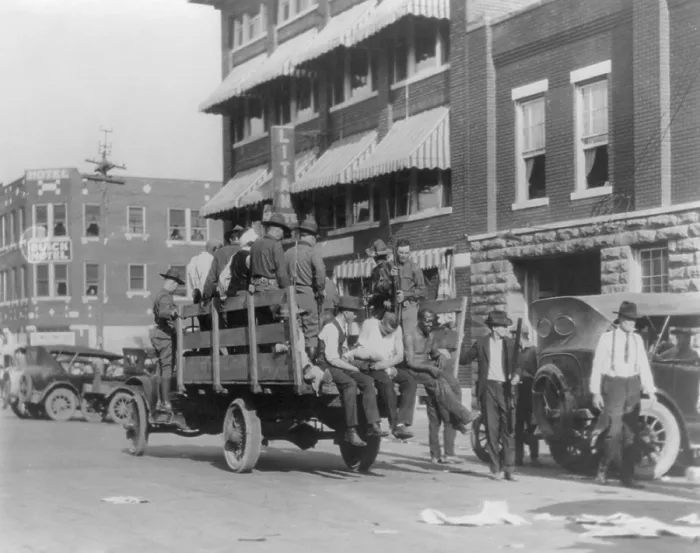Framed Print : Truck on street near Tulsa, Oklahoma's Litan Hotel carrying soldiers and injured African Americans during race riot of June 1921. Tulsa suffered the worst race riot in U.S Framed Print : Truck on street near Tulsa, Oklahoma's Litan Hotel carrying soldiers and injured African Americans during race riot of June 1921. Tulsa suffered the worst race riot in U.S