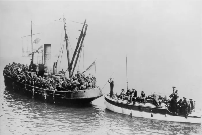 Framed Print : Tug boat with British Expeditionary Forces evacuating Dunkirk, pulls a troops in a small boat. World War 2, May 27-June 4, 1940. (BSLOC_2013_11_76)