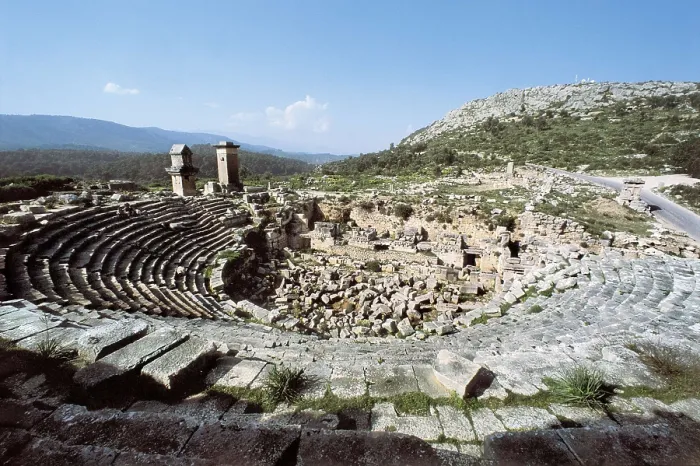 Framed Print : TURKEY. MEDITERRANEAN COAST. ANTALYA. Xanthus. Roman theatre (2nd c.). In the background on the left the funerary monument known as the Harpy Tower (480 BC). Roman art Framed Print : TURKEY. MEDITERRANEAN COAST. ANTALYA. Xanthus. Roman theatre (2nd c.). In the background on the left the funerary monument known as the Harpy Tower (480 BC). Roman art