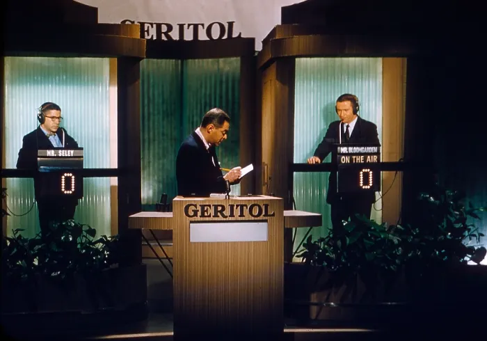 Framed Print : TWENTY-ONE, (aka 21), from left: contestant Mr. Seley (first name unknown), host Jack Barry, contestant Hank Bloomgarden, (1957), 1956-1958
