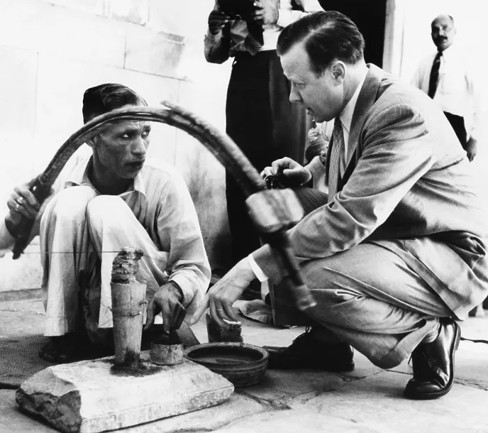 Framed Print : UAW President Walter Reuther talking with an stone cutter in New Delhi, India Framed Print : UAW President Walter Reuther talking with an stone cutter in New Delhi, India
