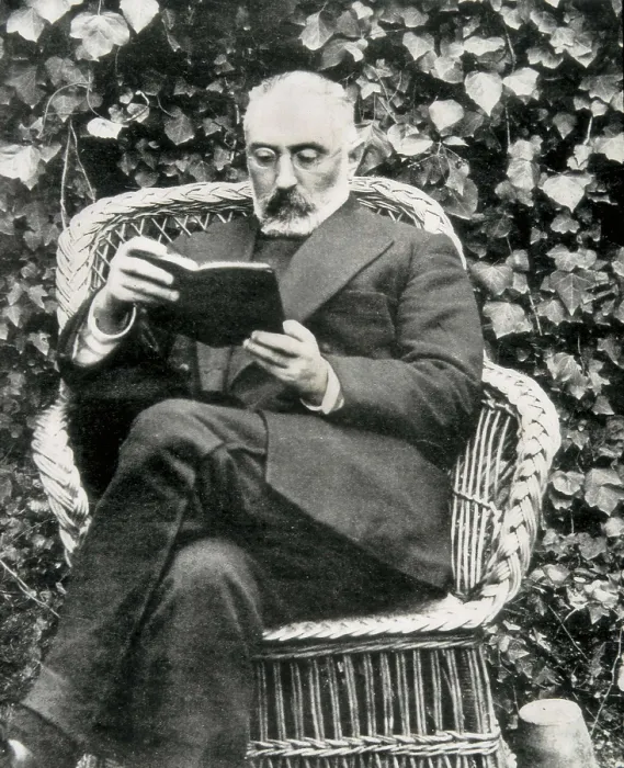 Framed Print : UNAMUNO, Miguel de (1864-1936). Miguel de Unamuno reading in a garden. Photography taken after his return from exile