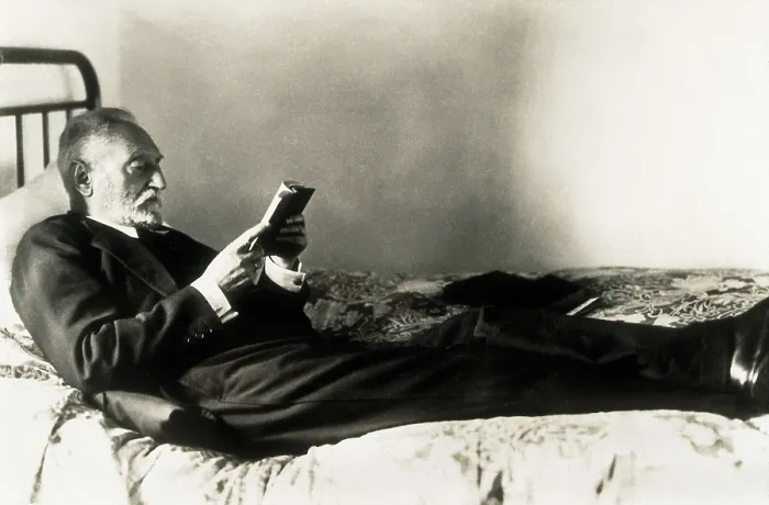 Framed Print : UNAMUNO, Miguel de (1864-1936). Miguel de Unamuno reads lying on the bed. AISA / Everett Collection**US SALES ONLY** Framed Print : UNAMUNO, Miguel de (1864-1936). Miguel de Unamuno reads lying on the bed. AISA / Everett Collection**US SALES ONLY**
