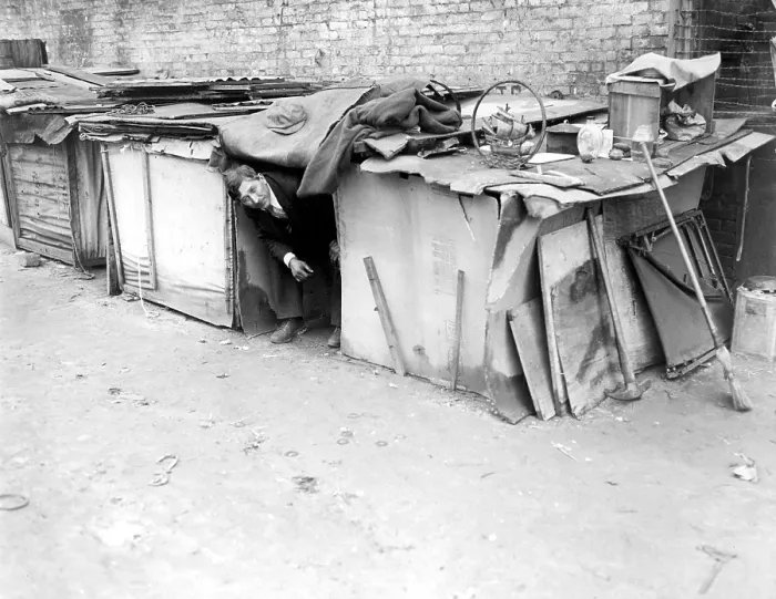 Framed Print : An unemployed man living in a shack constructed from packing cases and pieces of wood in New York City, off Broadway on West Houston Street. February 8, 1933 Framed Print : An unemployed man living in a shack constructed from packing cases and pieces of wood in New York City, off Broadway on West Houston Street. February 8, 1933
