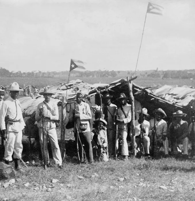 Framed Print : Uniformed Cuban soldiers in the field with their flag and weapons. The multi-racial group is at Guanabacoa, east of Havana, ca. 1899 (BSLOC_2017_10_43)