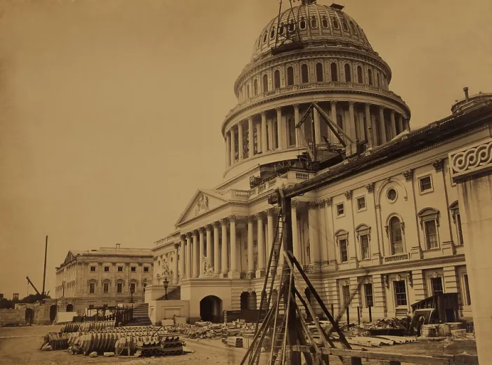 Framed Print : United States Capitol Building in 1863, showing the dome under construction. In the foreground are pre-formed cast-iron metal facings for the new dome. Photo by Andrew J. Russell Framed Print : United States Capitol Building in 1863, showing the dome under construction. In the foreground are pre-formed cast-iron metal facings for the new dome. Photo by Andrew J. Russell