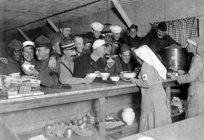 Framed Print : An unusual World War I scene of an African American soldier being served with American and French service men. American Red Cross canteen lunch bar at Bordeaux, France. Oct. 1918