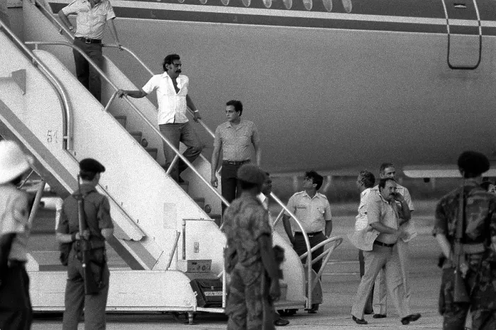 Framed Print : U.S. Air Force security police guard Cuban nationals as they board the airliner returning them to Cuba Framed Print : U.S. Air Force security police guard Cuban nationals as they board the airliner returning them to Cuba