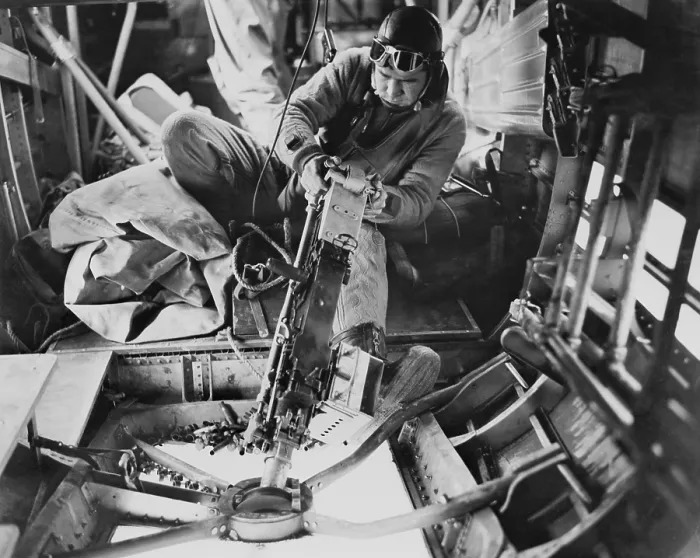 Framed Print : U.S. Army Air Force gunner operating a machine gun during a aerial fight with German planes. World War 2. Ca. 1942-43. (BSLOC_2014_6_33)