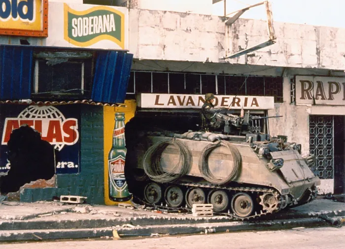 Framed Print : A U.S. Army armored personnel carrier finds shelter in a destroyed Panama City laundromat. Dec. 1989. (BSLOC_2011_3_21)