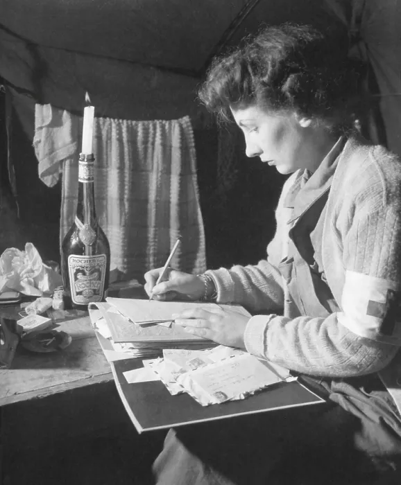 Framed Print : U.S. Army Nurse writes a letter home after 12 hours of work. She is at the 2nd Evacuation Hospital, somewhere in France. July 24, 1944. World War 2. (BSLOC_2014_10_207)