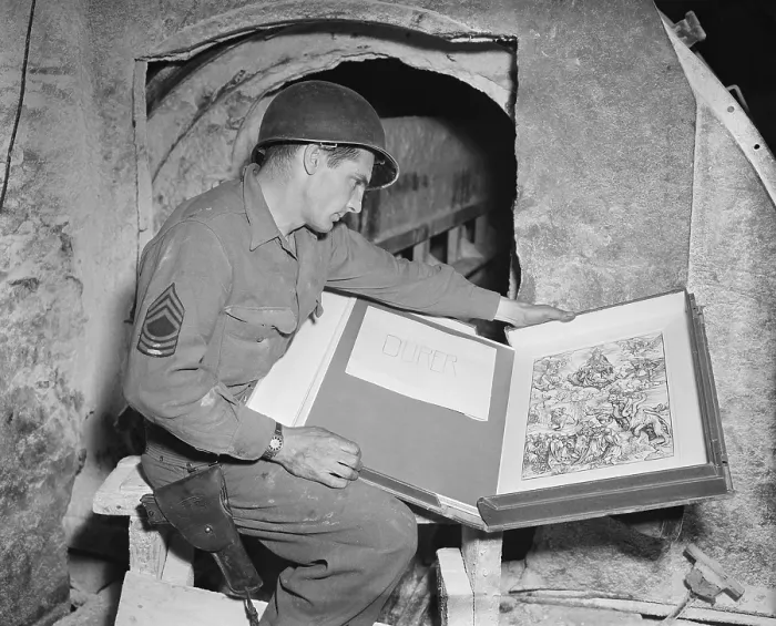 Framed Print : U.S. Army sergeant Harold Maus inspects a Durer engraving hidden in the Merkers salt mine