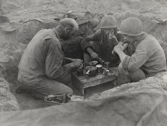 Framed Print : Three U.S. Army soldiers eat rations in a foxhole during the Battle of Saipan. Ca. June 15-July 9, 1944, during World War 2. (BSLOC_2013_14_55) Framed Print : Three U.S. Army soldiers eat rations in a foxhole during the Battle of Saipan. Ca. June 15-July 9, 1944, during World War 2. (BSLOC_2013_14_55)
