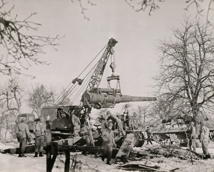 Framed Print : U.S. artillerymen in France assemble their 8 inch gun with the aid of a mechanical hoister. Fall-Winter 1944-45. World War 2. (BSLOC_2014_10_156)