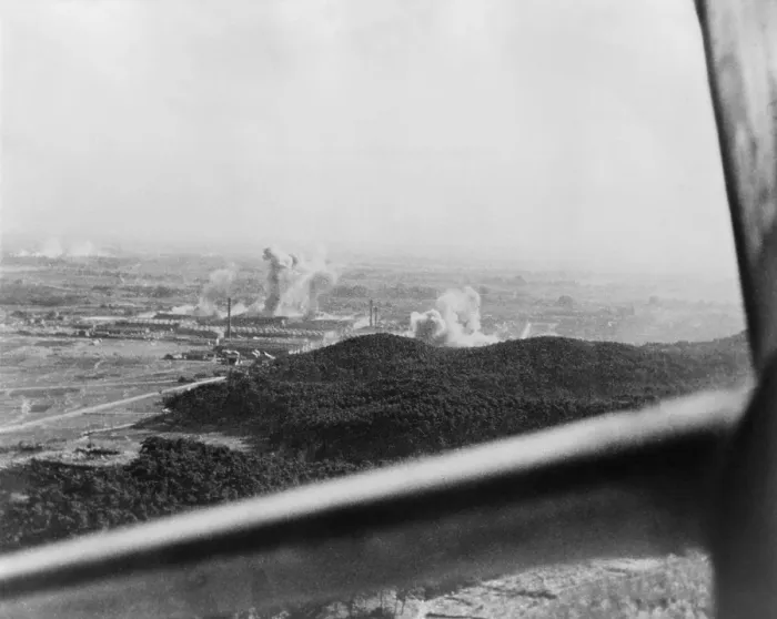 Framed Print : U.S. carrier-based planes bomb a factory plant near Tokyo in 1945. Framing the scene is the window of an American airplane. World War 2. (BSLOC_2014_10_118) Framed Print : U.S. carrier-based planes bomb a factory plant near Tokyo in 1945. Framing the scene is the window of an American airplane. World War 2. (BSLOC_2014_10_118)