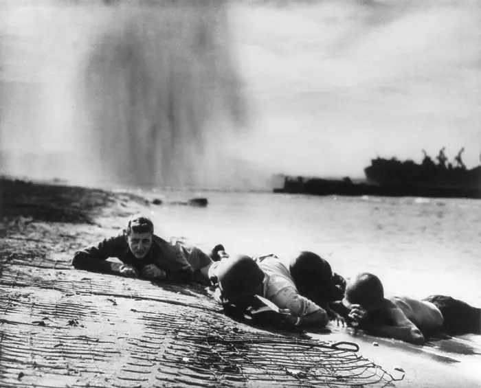 Framed Print : U.S. Coast Guardsmen and Navy beach battalion hugging the Italian beach during German bombing Framed Print : U.S. Coast Guardsmen and Navy beach battalion hugging the Italian beach during German bombing